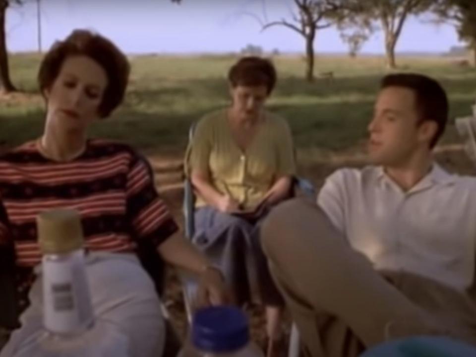 elaine and lawrence sitting outside at a picnic in daddy and them