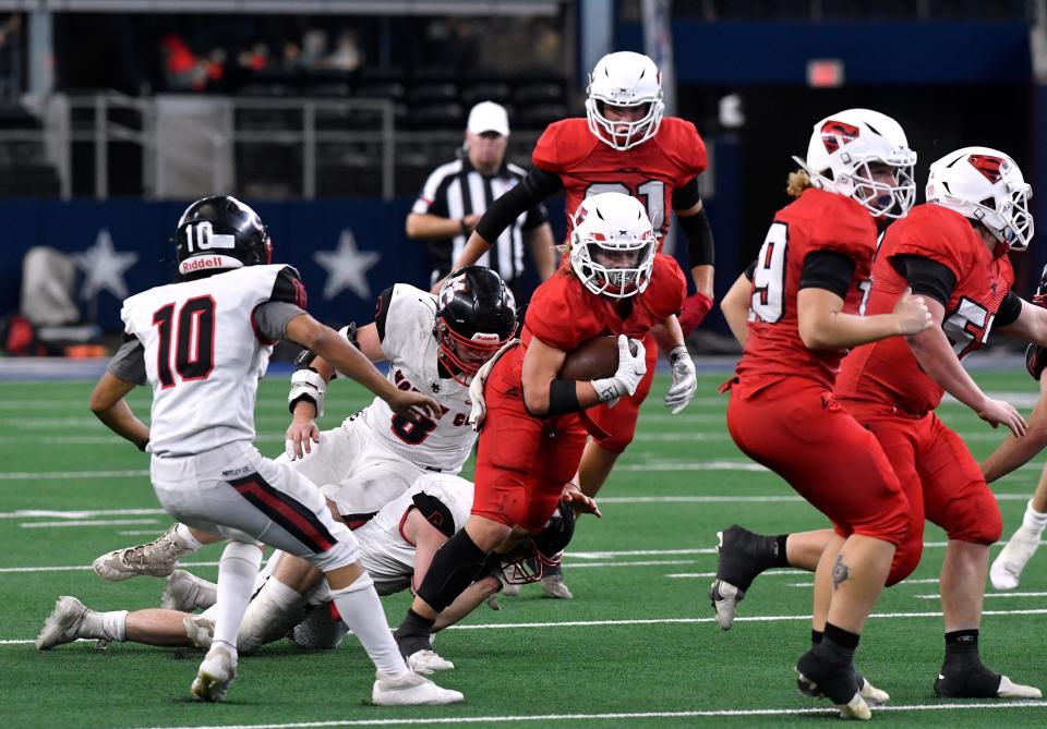 Strawn running back Grayson Rigdon carries the ball against Motley County during the Class 1A Div. II Six-Man state championship game in Arlington Dec. 15, 2021. Rigdon transferred to Benjamin after the 2021-22 school year.