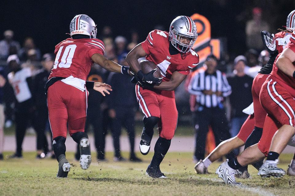 Williston Red Devils Jace Mcdonald (4) runs with the ball during the first half between Williston High School and Hawthorne High School at Williston High School in Williston, FL on Friday, November 24, 2023. [Chris Watkins/Gainesville Sun]
