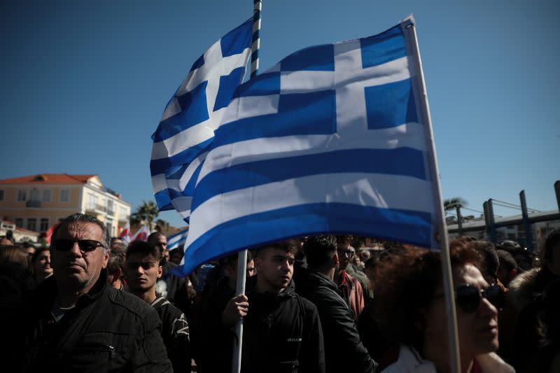 Locals, who oppose the building of a new closed migrant detention centre, take part in a demonstration in the city of Mytilene, on the island of Lesbos