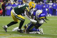 Los Angeles Rams' Darrell Henderson Jr. catches a touchdown pass during the first half of an NFL football game against the Green Bay Packers Sunday, Nov. 28, 2021, in Green Bay, Wis. (AP Photo/Matt Ludtke)