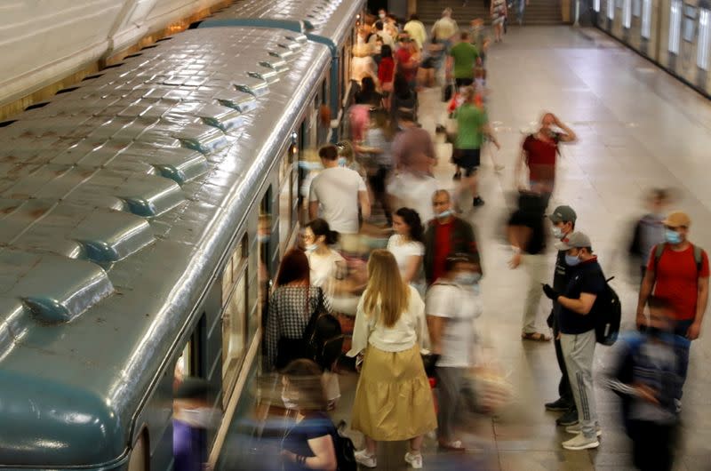 FILE PHOTO: Passengers are seen at a metro station in Moscow