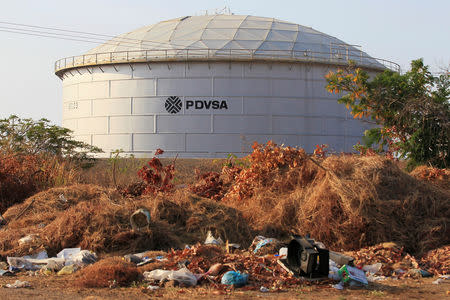 FILE PHOTO: The corporate logo of state oil company PDVSA is seen on a tank at an oil facility in Lagunillas, Venezuela January 29, 2019. REUTERS/Isaac Urrutia