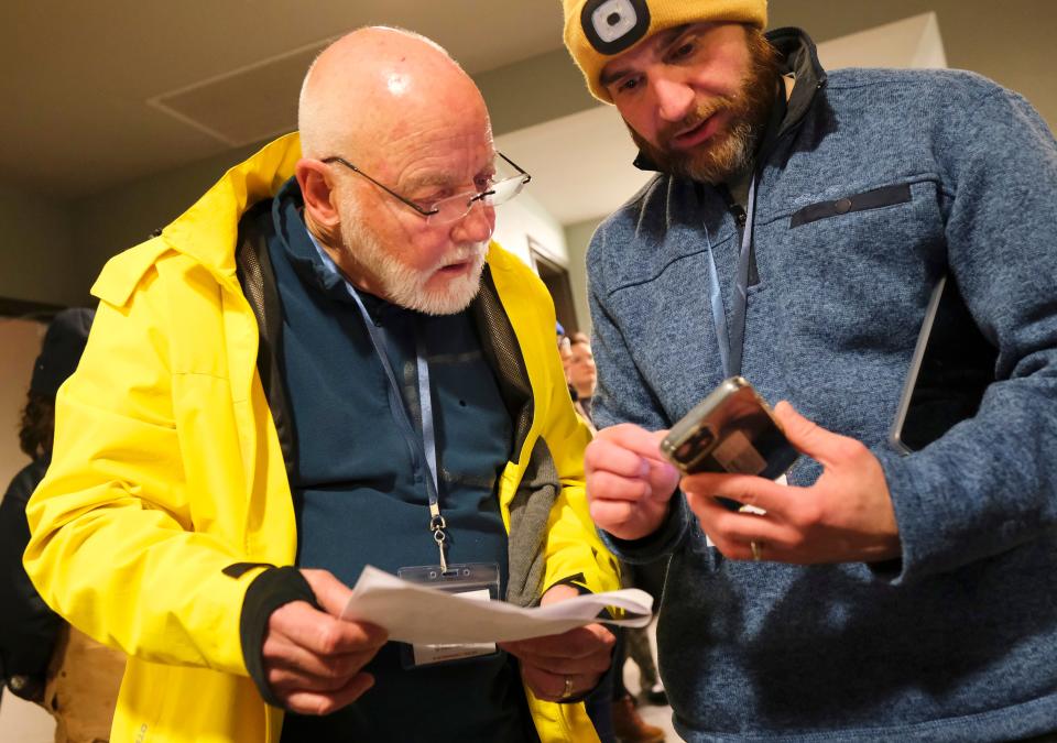 Dan Straughan, left, and Cale Powers look Jan. 25 at the areas their team will cover during the Oklahoma City Point-In-Time survey, coordinated by the Homeless Alliance, to count the homeless population.