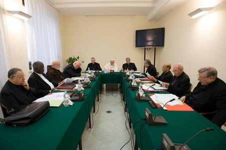 Pope Francis presides at a meeting of a permanent advisory group composed of nine high-ranking cardinals at the Vatican February 13, 2017. Osservatore Romano/Handout via REUTERS