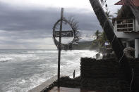 Restaurants overlook El Zonte beach in Tamanique, El Salvador, Wednesday, June 9, 2021. In this beach community, a nongovernmental organization with the financial backing of an anonymous Bitcoin donor has been trying to create a small-scale cryptocurrency economy, and could serve as a showcase for the gains and struggles to introduce a phone-based cryptocurrency as the country embarks on a nationwide experiment after making Bitcoin legal tender this week. (AP Photo/Salvador Melendez)