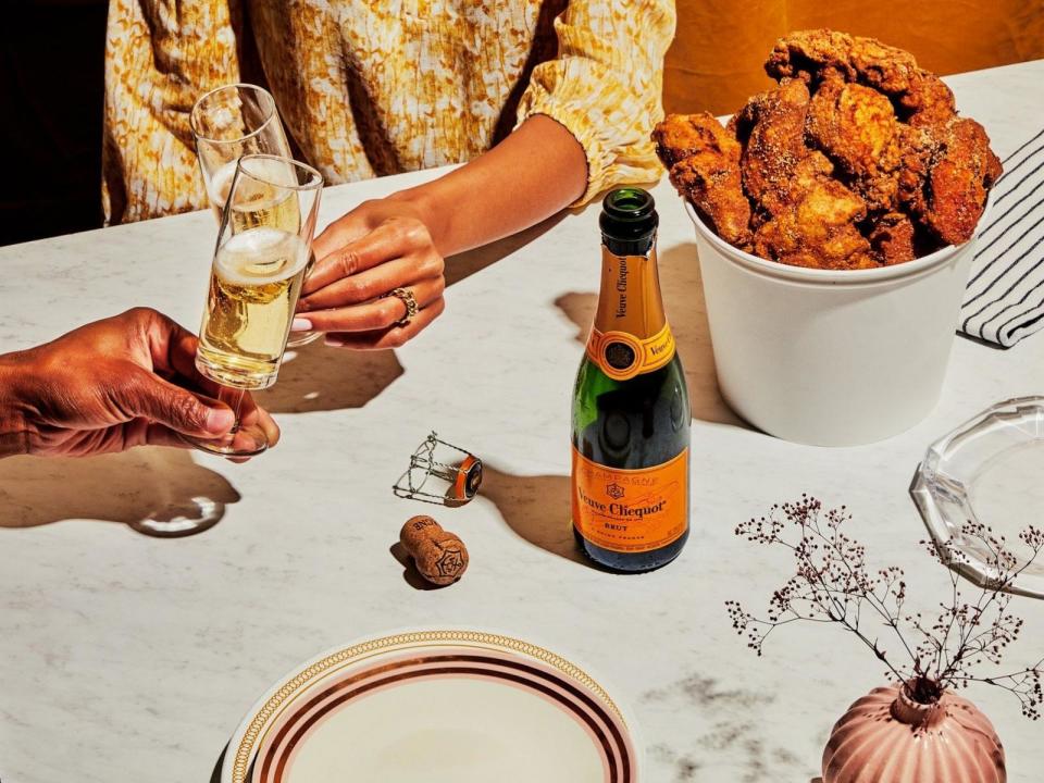 PHOTO: A food styled shoot with fried chicken paired with champagne. (Chelsie Craig; Limonata Creative; Alyssa Sadler )