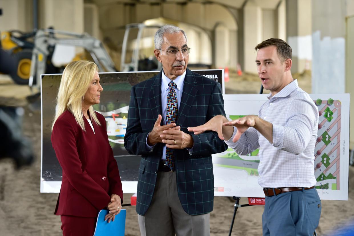 Jacksonville Mayor Donna Deegan, City Council President Ron Salem and Council Member Jimmy Peluso talk after a July announcement on the creation of Artist Walk city park under the Fuller Warren Bridge in Riverside.