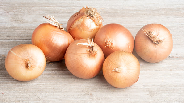 Vidalia yellow onions on table