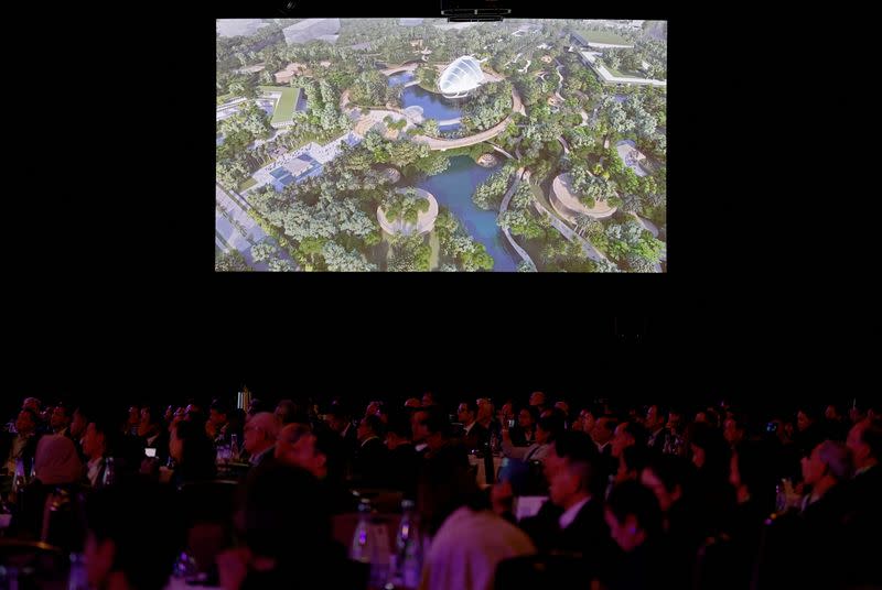 Attendees watch a video presentation of Indonesia's planned capital Nusantara, at Ecosperity Week in Singapore