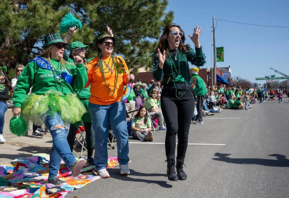 Carla Strong of Mound City, Kansas, from left, an unidentifed woman, Sharon Matthews of Mission, and Ginger Brand of Edswardville, Kansas, cheered as they watched the 38th annual Shawnee St. Patrick’s Day Parade on Sunday, March 10, 2024.