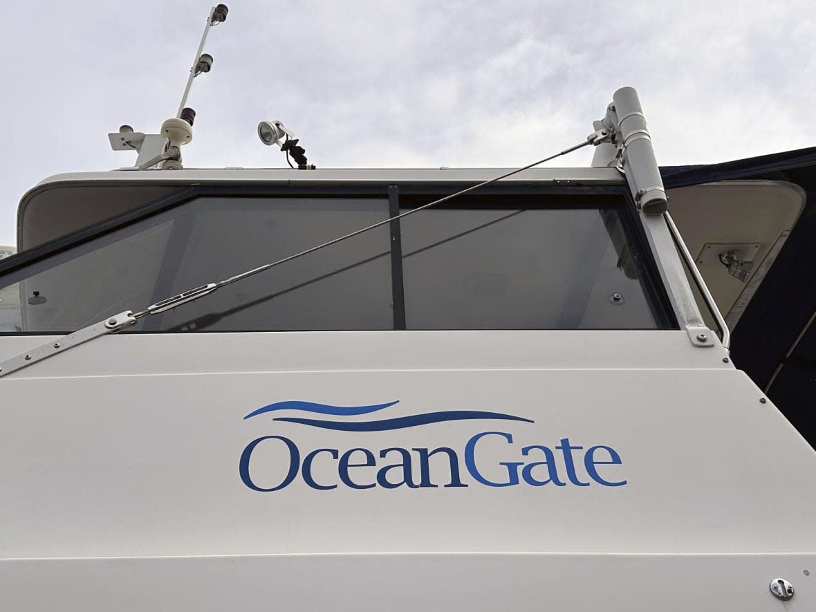 The logo for OceanGate Expeditions is seen on a boat parked near the offices of the company at a marine industrial warehouse office door in Everett, Wash., Tuesday, June 20, 2023. AP Photo/Ed Komenda)