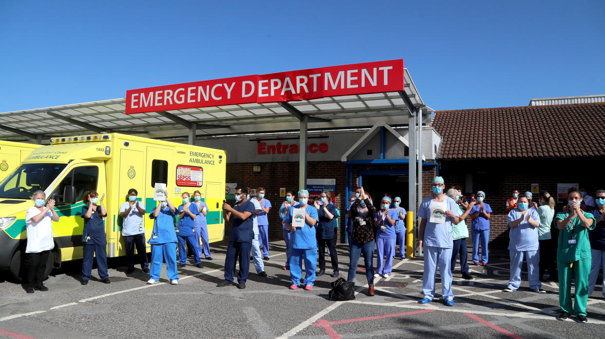 NHS staff outside the William Harvey Hospital in Ashford, Kent, join in the pause for applause to salute the NHS 72nd birthday.