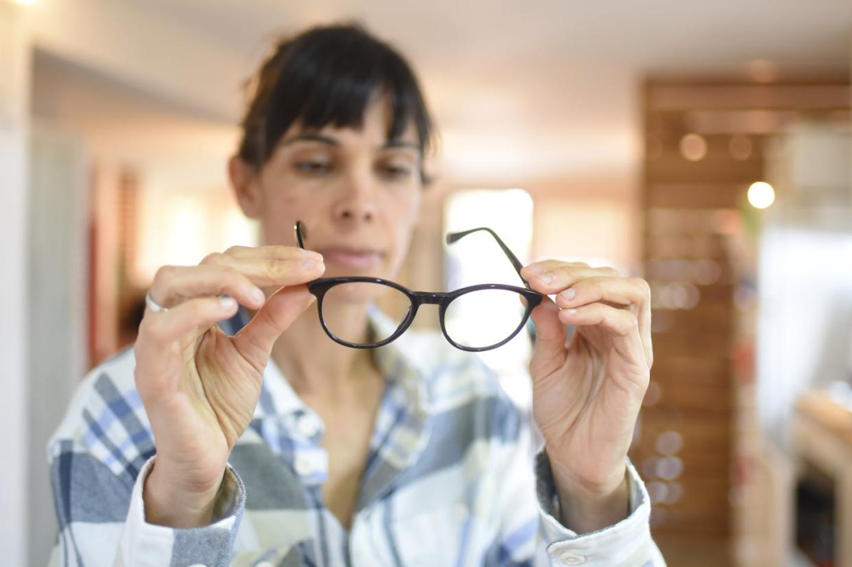 For people tired of wearing glasses, the claims can be enticing. <a href="https://www.gettyimages.com/detail/photo/woman-with-glasses-royalty-free-image/1413693485?phrase=middle+age+eyes+wearing+glasses&adppopup=true" rel="nofollow noopener" target="_blank" data-ylk="slk:Valeria Blanc/E+ via Getty Images;elm:context_link;itc:0;sec:content-canvas" class="link ">Valeria Blanc/E+ via Getty Images</a>