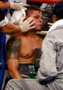 KISSIMMEE, FL - OCTOBER 19: Trainers for boxer Orlando Cruz work on him in his corner at Kissimmee Civic Center on October 19, 2012 in Kissimmee, Florida. (Photo by J. Meric/Getty Images)