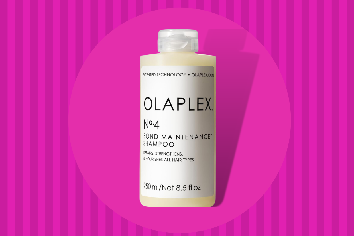 Olaplex's No.4 Bond Maintenance Shampoo on a pink background