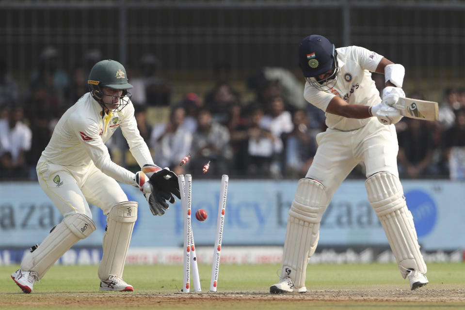 India's Cheteshwar Pujara is bowled out during the first day of third cricket test match between India and Australia in Indore, India, Wednesday, March 1, 2023. (AP Photo/Surjeet Yadav)