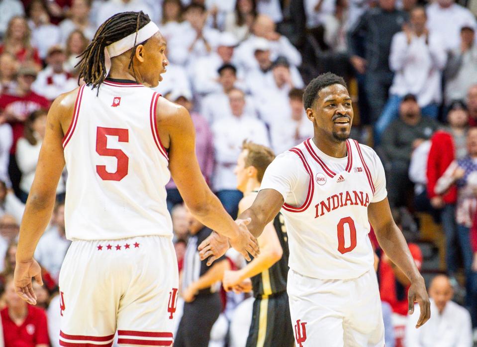 Indiana's Xavier Johnson (0) and Malik Reneau (5) slap hands during the first half of the Indiana versus Purdue men's basketball game at Simon Skjodt Assembly Hall on Tuesday, Jan. 16, 2024.