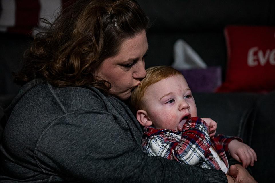 Wesson Keene, 1, gets a kiss from his mother, Nicole Keene, during a recent therapy session for the boy at their home in Lexington, Ky. In June, Wesson’s doctor diagnosed him with cerebral palsy.