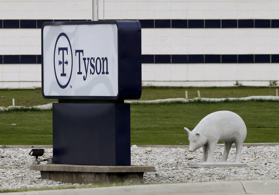 In this May 1, 2020, file photo, a sign sits in front of the Tyson Foods plant in Waterloo, Iowa. A group of worker advocacy organizations has filed a civil rights complaint with the U.S. Department of Agriculture alleging that meat processing companies Tyson and JBS have engaged in workplace racial discrimination during the coronavirus pandemic. The complaint alleges the companies adopted polices that reject U.S. Centers for Disease Control and Prevention guidance on distancing and protective gear on meat processing lines. The complaint says the operating procedures have a discriminatory impact on mostly Black, Latino, and Asian workers. (AP Photo/Charlie Neibergall, file)