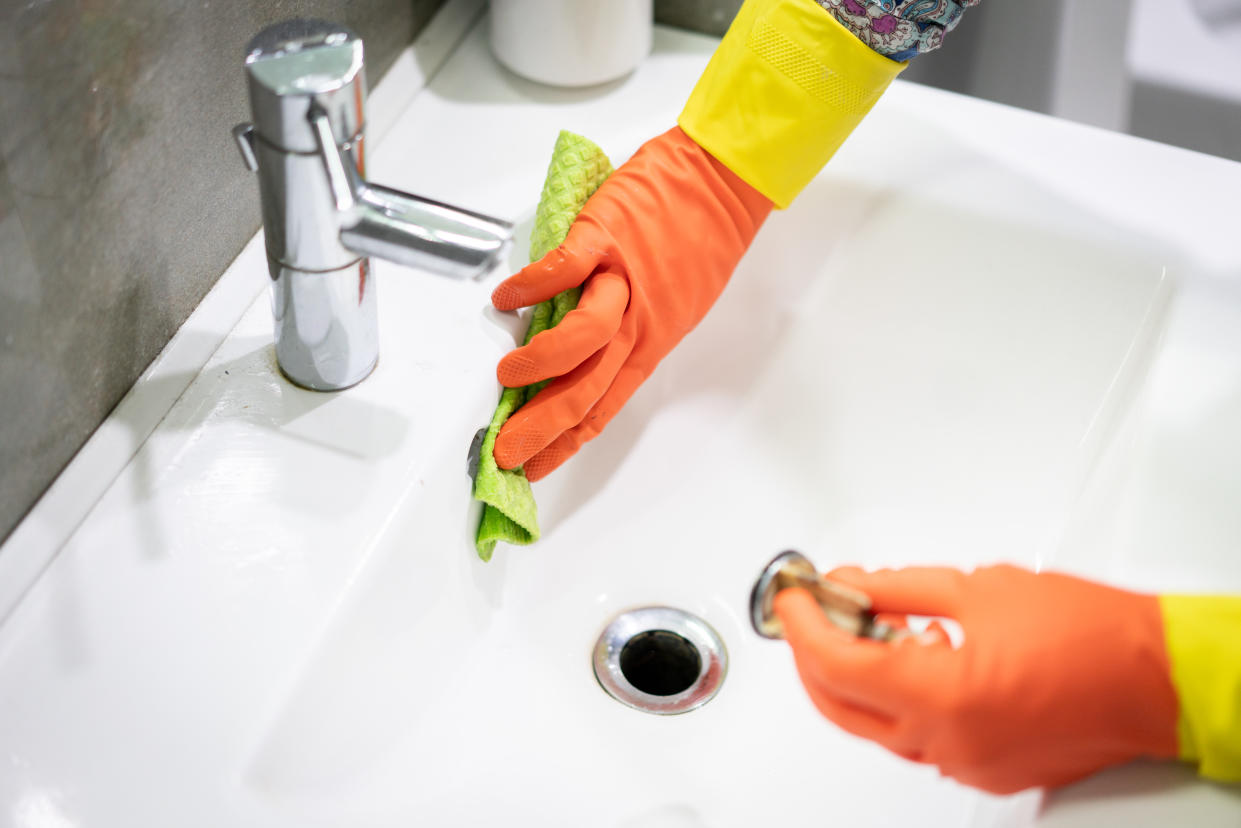 orange cleaning gloves cleaning bathroom sink, Yahoo Canada asked cleaning expert Kim Dunn to review some of the most popular viral cleaning products. 