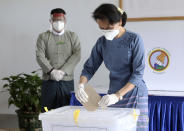 FILE - Myanmar's leader Aung San Suu Kyi makes an early voting for upcoming Nov. 8 general election at Union Election Commission office in Naypyitaw, Myanmar on Oct. 29, 2020. Suu Kyi is the daughter of the country’s independence hero, Gen. Aung San, who was assassinated in 1947, less than six months before the country, then called Burma, became independent from Britain. Suu Kyi moved to New Delhi in 1960 when her mother was appointed ambassador to India and then spent most of her young adult life in the United States and England. Her career in politics began in 1988. (AP Photo/Aung Shine Oo, File)