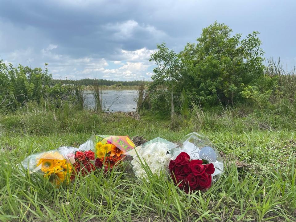 People have started leaving flowers at the site of a crash along Topgolf Way in Fort Myers after five people, at least four of them workers at nearby Texas Roadhouse, crashed late Sunday, June 25, 2023.