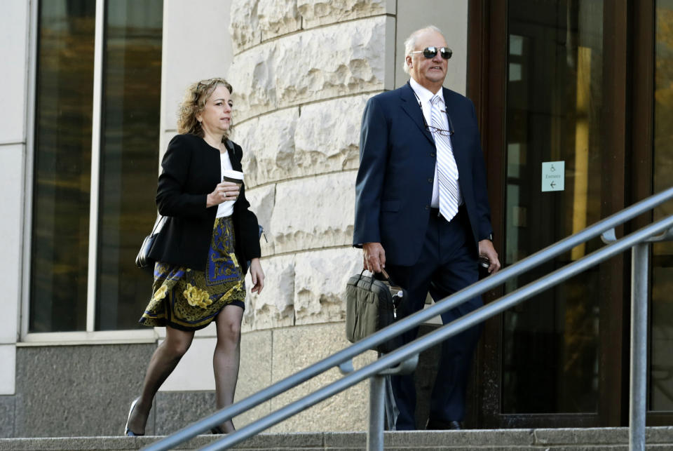 Attorneys for the plaintiffs Linda Singer, left, and Joe Rice enter the U.S. Federal courthouse, Monday, Oct. 21, 2019, in Cleveland. The nation's three dominant drug distributors and a big drugmaker have reached a tentative deal to settle a lawsuit related to the opioid crisis just as the first federal trial over the crisis was due to begin Monday, according to a lead lawyer for the local governments suing the drug industry. (AP Photo/Tony Dejak)