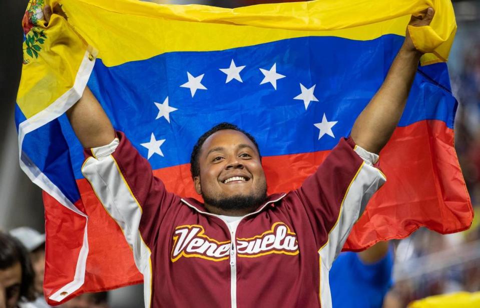 A Venezuelan fan is seen during the third inning of a Pool D game between Venezuela and Nicaragua at the World Baseball Classic at loanDepot Park on Tuesday, March 14, 2023, in Miami, Fla.