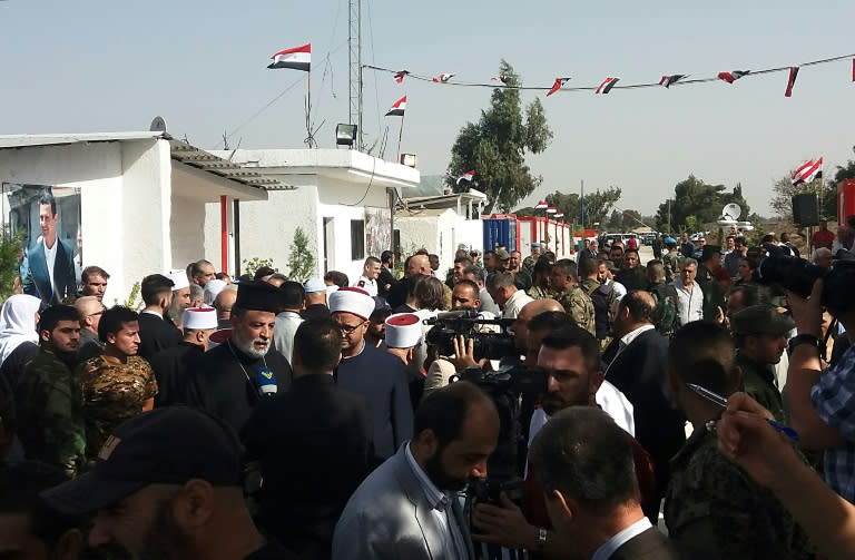 Crowds gather at Syria's Quneitra border crossing with the Israeli-annexed Golan Heights on the day of its reopening