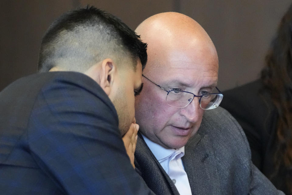 Robert E. Crimo Jr., right, listen to his attorney George Gomez, during an appearance before Judge George D. Strickland at the Lake County Courthouse, Friday, July 14, 2023, in Waukegan, Ill. Judge George Strickland on Friday set a Nov. 6 trial date for Crimo Jr. who is charged with helping his son obtain a gun license three years before the son allegedly shot dead seven people at a Fourth of July parade in suburban Chicago last year. (AP Photo/Nam Y. Huh, Pool)