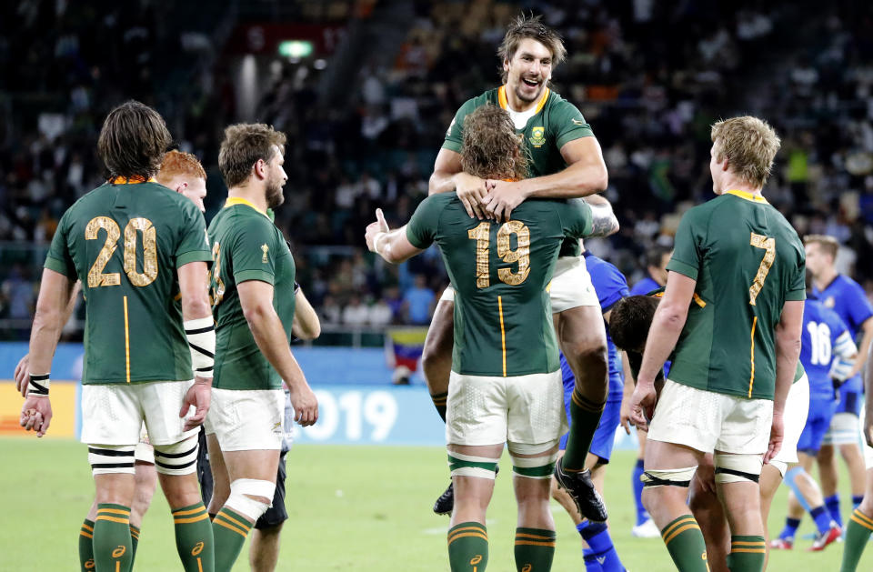 South Africa's Eben Etzebeth celebrates with teammate RG Snyman following their Rugby World Cup Pool B game at Shizuoka Stadium Ecopa against Italy in Shizuoka, Japan, Friday, Oct. 4, 2019. South Africa defeated Italy 49-3. (AP Photo/Shuji Kajiyama)