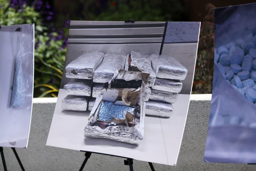 LOS ANGELES, CA - MAY 13: A photograph is displayed showing seized fake pills during a press conference about a series of criminal cases against alleged drug dealers who sold or provided narcotics to users who suffered fatal overdoses from opioids such as fentanyl or fentanyl analogues in downtown on Thursday, May 13, 2021 in Los Angeles, CA. Fentanyl and other highly potent synthetic opioids remain the primary driver behind the ongoing opioid crises. (Dania Maxwell / Los Angeles Times)