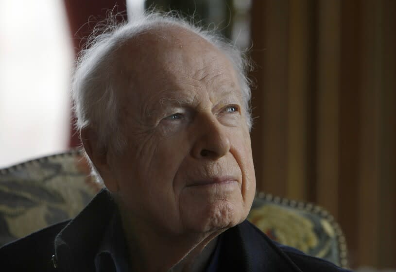 FILE - British theatre director Peter Brook, is photographed, during a reception after being awarded the Great Vermeil medal of Paris, at the city hall Paris, Tuesday, Jan. 25, 2011. Brook, a British theater director known for an influential and distinguished career which saw him garner worldwide acclaim, has died. He was 97. The two-time Tony Award winner, who had settled in France since the 1970s, also directed the film adaptations of his best stage works as well as the 1963 release of "Lord of the Flies". (AP Photo/Jacques Brinon, File )