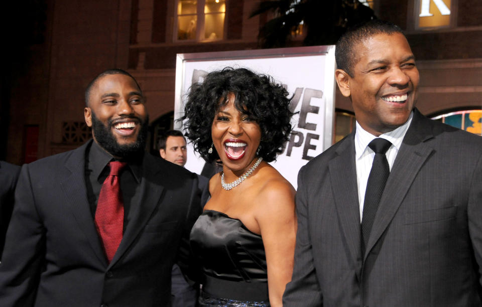 HOLLYWOOD, CA - JANUARY 11: John David Washington, Pauletta Washington and Denzel Washington arrive at "The Book Of Eli" Los Angeles Premiere at Grauman's Chinese Theater on January 11, 2010 in Hollywood, California.  (Photo by Gregg DeGuire/FilmMagic)