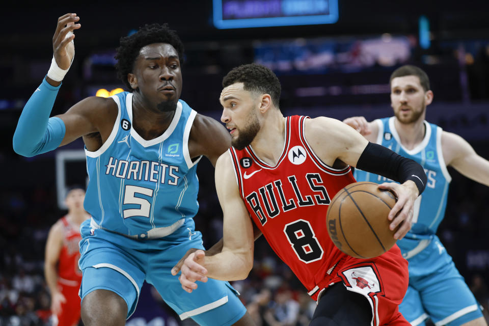 Chicago Bulls guard Zach LaVine (8) drives against Charlotte Hornets center Mark Williams (5) during the first half of an NBA basketball game in Charlotte, N.C., Friday, March 31, 2023. (AP Photo/Nell Redmond)