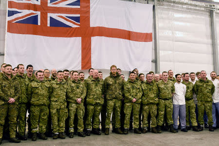 Britain's Prince Harry, Captain General Royal Marines, poses for a group photo during Exercise Clockwork's 50 year anniversary of cold weather military training at Bardufoss Air Station, Norway February 14, 2019. NTB Scanpix/Rune Stoltz Bertinussen via REUTERS