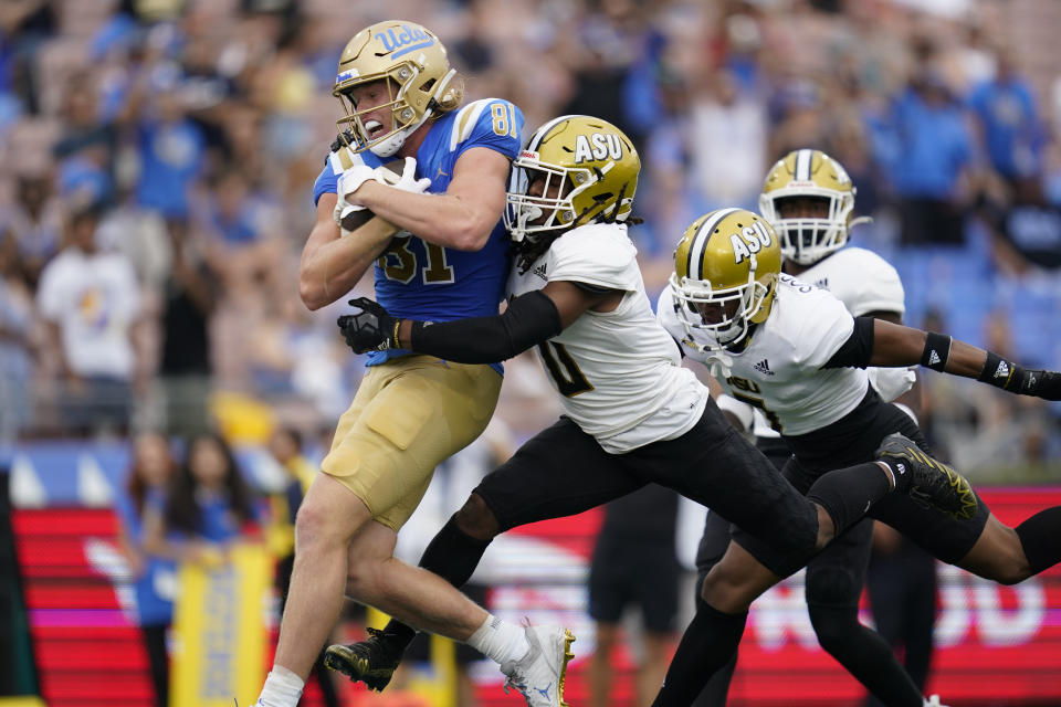 UCLA tight end Hudson Habermehl (81) runs to the end zone for a touchdown while defended by Alabama State defensive back Irshaad Davis (0) during the first half of an NCAA college football game in Pasadena, Calif., Saturday, Sept. 10, 2022. (AP Photo/Ashley Landis)