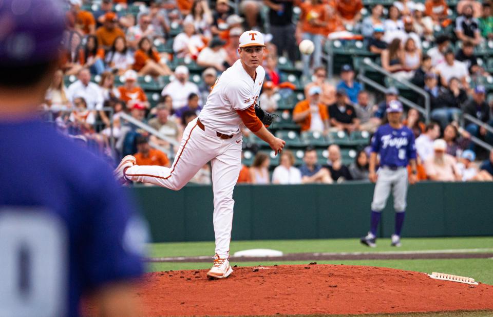 Texas pitcher Max Grubbs throws to first base in a pickoff attempt during the second inning of Friday's 5-0 loss to TCU at UFCU Disch-Falk Field. The Longhorns have now lost the first game in six straight series.