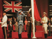 FILE - In this July 1, 1997, file photo, members of the combined Chinese Armed Forces raise the Chinese Flag at the Hong Kong convention center marking the moment Hong Kong reverted to Chinese rule. Hong Kong has been living on borrowed time ever since the British made it a colony nearly 180 years ago, and all the more so after Beijing took control in 1997, granting it autonomous status. A national security law approved by China's legislature on May 28, 2020 is a reminder that the city's special status is in the hands of Communist Party leaders who have spent decades building their own trade and financial centers to take Hong Kong's place. (Kimimasa Mayama/Pool Photo via AP)