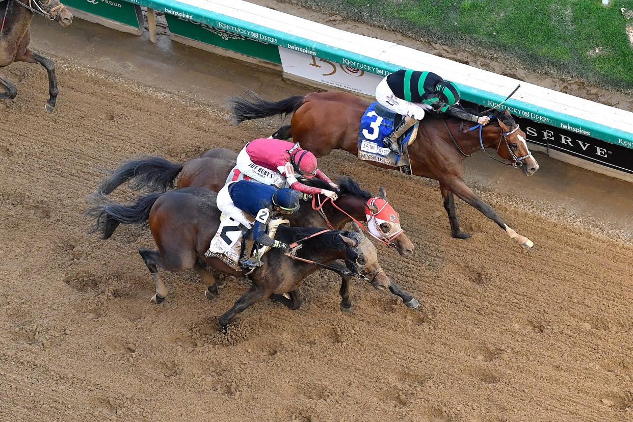 Mystic Dan (3), with Brian J. Hernandez Jr. up, leads Sierra Leone (2), with Tyler Gaffalione up, across the line to win the 150th running of The Kentucky Derby, Saturday, May 4 2024 in Louisville Ky.