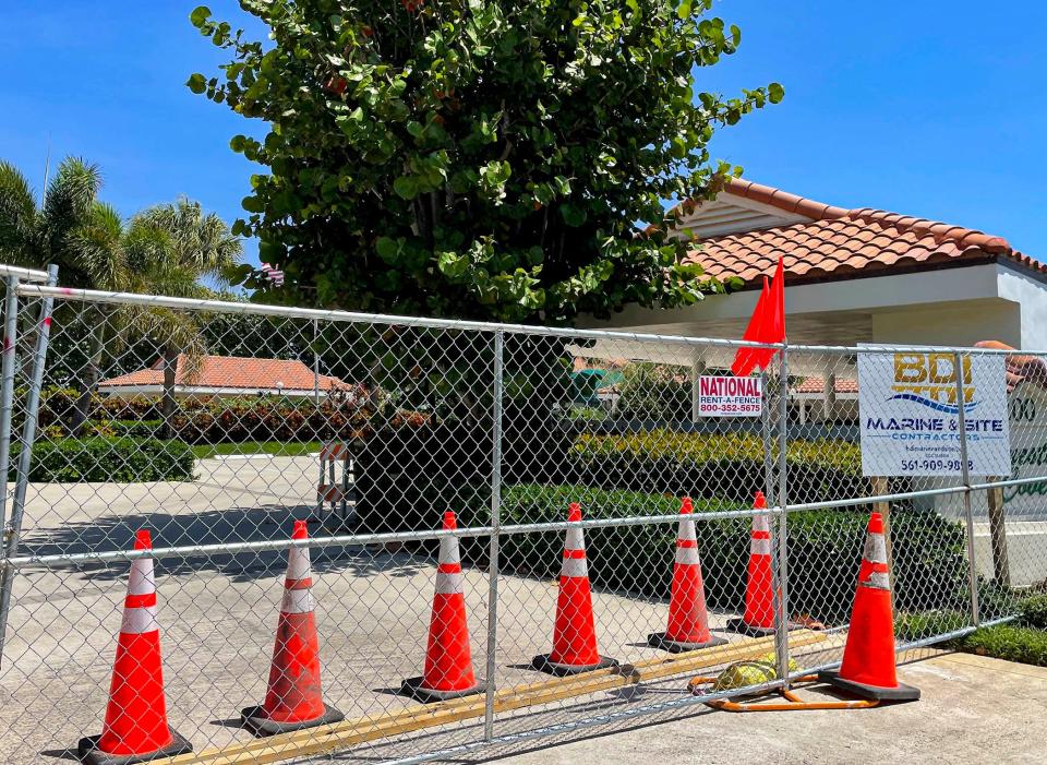 Construction fencing blocks the entrance to Tequesta Cove off Waterway Road near the Intracoastal on April 14, 2022. The 24-condo building was evacuated March 23 after inspectors deemed it unsafe.