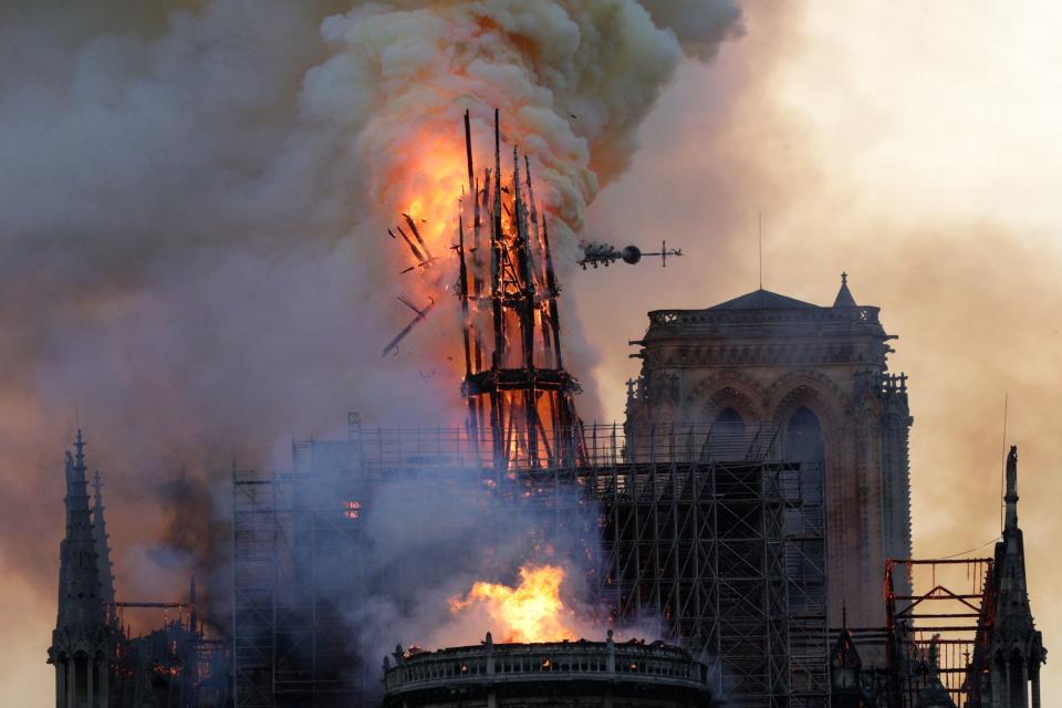 The steeple collapses as smoke and flames engulf the Notre-Dame Cathedral in Paris on April 15, 2019. (Photo: Geoffroy Van Der Hasselt/AFP/Getty Images)