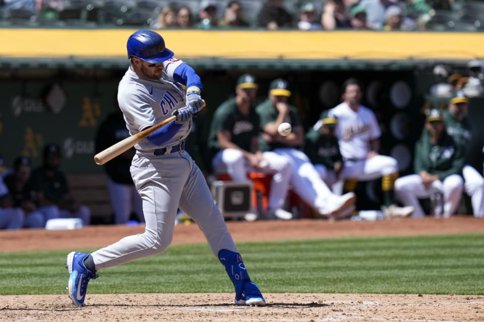 Chicago Cubs' Patrick Wisdom hits a two-run triple against the Oakland Athletics during the sixth inning of a baseball game in Oakland, Calif., Wednesday, April 19, 2023. (AP Photo/Godofredo A. Vásquez)