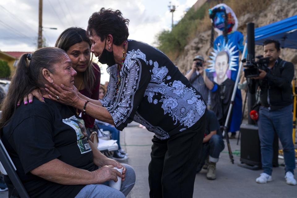 Maria Guadalupe Güereca (left) is embraced by Araceli Rodríguez (left center) and Taide Elena (center) during a mass to honor José Antonio Elena Rodríguez on the 10-year anniversary of his killing on Oct. 9, 2022, in Nogales, Sonora, Mexico. Güereca, mother of Sergio Adrian Hernandez Güereca who was killed by U.S. Border Patrol in Ciudad Juárez, Mexico, came to honor Rodríguez's and Elena's son and grandson respectively, who was killed by U.S. Border Patrol in steps away from where they sit.