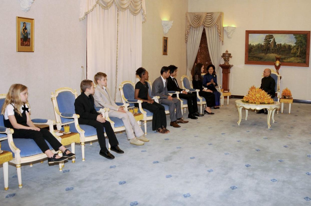 Hollywood star Angelina Jolie (3rd R) attends an audience with Cambodian King Norodom Sihamoni (R) as her children look on at the royal residence in Siem Reap on February 18, 2017.Angelina Jolie will unveil her new film on the horrors of the Khmer Rouge era on February 18 at the ancient Angkor Wat temple complex in Cambodia, a country the star shares a deep affinity with through her adopted son Maddox. / AFP / STR        (Photo credit should read STR/AFP/Getty Images)