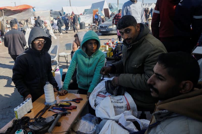 Displaced Gazans turn to cobblers amid shortages of new footwear, in Rafah