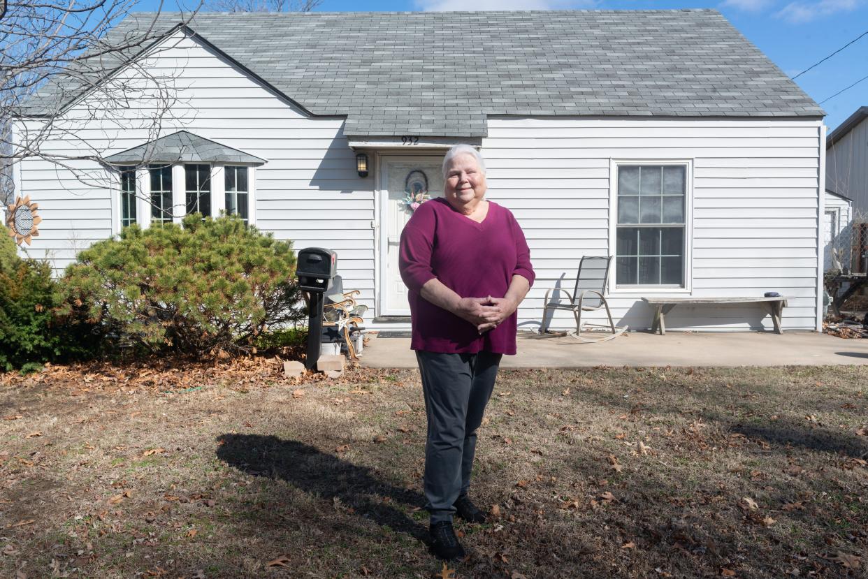 Longtime Topekan Cindy Miller stands in front of her home in the 900 block of S.W. Medford Avenue. She has lived there for almost 70 years.