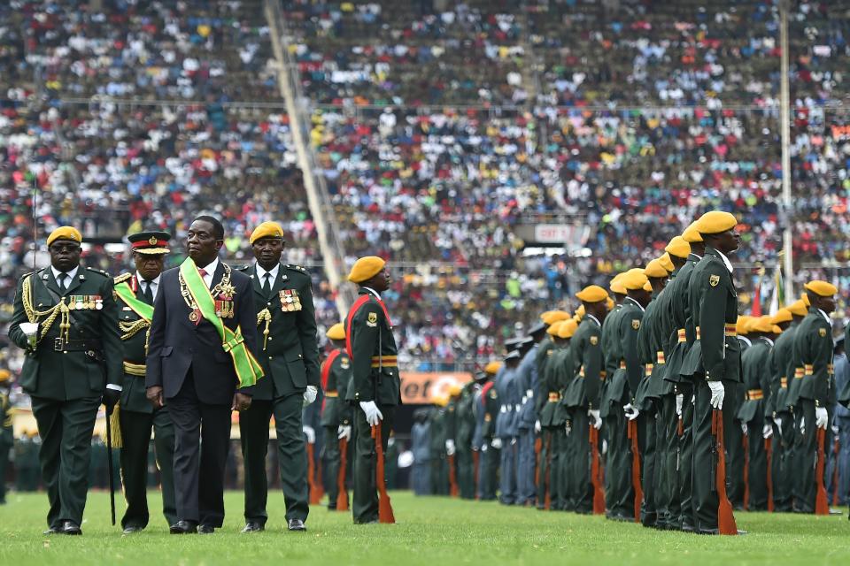 Zimbabwe's new interim president, Emmerson Mnangagwa, performs his first inspection of the Guard of Honour after he is officially sworn in on Nov. 24, 2017. (Photo: TONY KARUMBA/Getty Images)