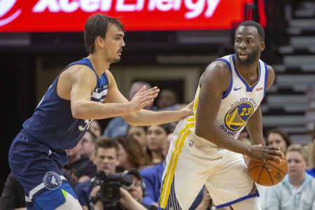 FILE PHOTO: Mar 29, 2019; Minneapolis, MN, USA; Golden State Warriors forward Draymond Green (23) looks to pass the ball as Minnesota Timberwolves forward Dario Saric (36) plays defense in the second half at Target Center. Mandatory Credit: Jesse Johnson-USA TODAY Sports
